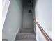 Carpeted stairway with a wooden handrail at 796 Glynn Oaks Dr, Clarkston, GA 30021