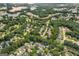 Aerial view reveals a community with a golf course and lake, showcasing neighborhood amenities at 2600 Neighborhood Walk, Villa Rica, GA 30180
