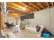Spacious unfinished basement with a couch, chairs and natural lighting at 2600 Neighborhood Walk, Villa Rica, GA 30180