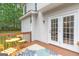 A cozy outdoor deck with table and chairs, perfect for relaxing or enjoying a meal outside at 2600 Neighborhood Walk, Villa Rica, GA 30180