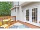 A cozy outdoor deck with table and chairs, perfect for relaxing or enjoying a meal outside at 2600 Neighborhood Walk, Villa Rica, GA 30180