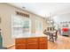 Open concept kitchen and dining area with hardwood floors and lots of natural light at 2600 Neighborhood Walk, Villa Rica, GA 30180
