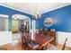 Dining room with hardwood floors and a classic chandelier, creating an elegant setting for meals and gatherings at 2600 Neighborhood Walk, Villa Rica, GA 30180
