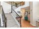 Grand foyer featuring hardwood floors, iron-railed staircase, with views of the home's open layout at 2600 Neighborhood Walk, Villa Rica, GA 30180