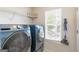 Laundry room featuring a front load washer and dryer and a window at 2600 Neighborhood Walk, Villa Rica, GA 30180