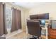 Office with a window, gray drapes, a computer desk and a black rolling chair at 2600 Neighborhood Walk, Villa Rica, GA 30180