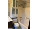 Functional bathroom with a toilet, a vanity, a bathtub, and built-in storage cabinets at 410 Clubland Se Cir, Conyers, GA 30094