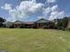 Charming one-story brick home with a well-manicured lawn and neatly trimmed shrubbery at 410 Clubland Se Cir, Conyers, GA 30094