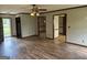Well-lit living space with wood-look flooring, offering views of other rooms and a front yard at 410 Clubland Se Cir, Conyers, GA 30094