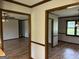 Open living space with hardwood-style floors and dark trim, offering access to multiple rooms at 410 Clubland Se Cir, Conyers, GA 30094