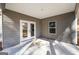 Covered back porch with white ceiling and concrete floors, providing outdoor living space at 296 Deer Creek Run # 11, Moreland, GA 30259