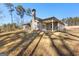 The backyard features a well-maintained lawn, mature trees, and patio area for outdoor enjoyment at 296 Deer Creek Run # 11, Moreland, GA 30259