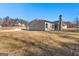 Expansive backyard with mature trees surrounding the property, offering privacy and scenic views at 296 Deer Creek Run # 11, Moreland, GA 30259
