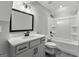 Well-lit bathroom with a modern vanity, mirror, and shower-tub combination at 296 Deer Creek Run # 11, Moreland, GA 30259