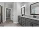 Modern bathroom with double vanity, granite countertops, and a tiled floor at 296 Deer Creek Run # 11, Moreland, GA 30259