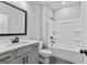 Bathroom featuring a vanity with a dark framed mirror and a shower and tub combo at 296 Deer Creek Run # 11, Moreland, GA 30259