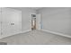 Spacious bedroom with carpeted floors, access to other rooms, and a large closet at 296 Deer Creek Run # 11, Moreland, GA 30259