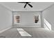 Spacious bedroom with two windows and neutral carpet at 296 Deer Creek Run # 11, Moreland, GA 30259