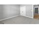 Bedroom featuring a double door closet, neutral walls, and carpeted floors at 296 Deer Creek Run # 11, Moreland, GA 30259
