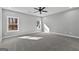 Bright bedroom with two windows, a ceiling fan, and neutral carpet at 296 Deer Creek Run # 11, Moreland, GA 30259