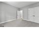 Bedroom featuring a closet, neutral walls, and carpeted floors at 296 Deer Creek Run # 11, Moreland, GA 30259