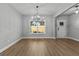 Bright dining area featuring light wood floors, neutral walls, and a view of the surrounding landscape at 296 Deer Creek Run # 11, Moreland, GA 30259