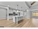 Modern kitchen with white cabinets, an island, and stainless steel appliances at 296 Deer Creek Run # 11, Moreland, GA 30259