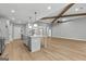 Spacious kitchen with an island, modern light fixtures, and stainless steel appliances at 296 Deer Creek Run # 11, Moreland, GA 30259