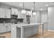 Modern kitchen with granite countertops, stainless steel appliances, and center island at 296 Deer Creek Run # 11, Moreland, GA 30259