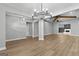 Spacious living area with wood-look floors, featuring a fireplace and wooden beam accents at 296 Deer Creek Run # 11, Moreland, GA 30259