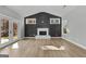 Bright living room with fireplace, gray walls and wood-look flooring at 296 Deer Creek Run # 11, Moreland, GA 30259