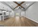 Spacious living area featuring exposed beams and wood-look flooring at 296 Deer Creek Run # 11, Moreland, GA 30259