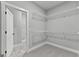 Large walk-in closet with metal shelving and access to additional rooms at 296 Deer Creek Run # 11, Moreland, GA 30259