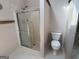Clean bathroom with enclosed shower, toilet, and neutral finishes, awaiting personal touch at 404 Windsor Way, Peachtree City, GA 30269