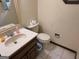 Cozy bathroom with classic vanity, toilet, and neutral tones at 404 Windsor Way, Peachtree City, GA 30269