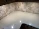 Close-up of a quartz countertop with a tiled backsplash and electrical outlets at 404 Windsor Way, Peachtree City, GA 30269