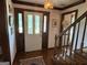 Traditional foyer with hardwood floors, leaded glass door, and staircase leading to the upper level at 404 Windsor Way, Peachtree City, GA 30269