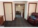 Hallway with a patterned carpet, traditional doors, and furniture at 404 Windsor Way, Peachtree City, GA 30269
