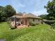 An expansive brick patio with outdoor seating, perfect for entertaining, and a well-manicured lawn at 404 Windsor Way, Peachtree City, GA 30269
