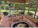 Comfortable sunroom with tiled floor, table and chairs to sit and enjoy the view at 404 Windsor Way, Peachtree City, GA 30269