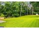 Lush backyard with mature trees provides ample space and privacy, accentuated by a storage shed at 1981 Shalimar Ne Dr, Atlanta, GA 30345