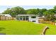 Large, lush backyard highlights a well-manicured lawn, sunroom, and privacy fence for serene outdoor living at 1981 Shalimar Ne Dr, Atlanta, GA 30345