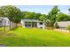 Expansive backyard showcases a well-maintained lawn and sunroom, perfect for outdoor enjoyment at 1981 Shalimar Ne Dr, Atlanta, GA 30345