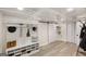 Finished basement mud room boasts a functional storage system, coat rack, and convenient sliding barn door at 1981 Shalimar Ne Dr, Atlanta, GA 30345