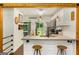 Charming kitchen with white cabinets, subway tile backsplash, concrete counters, and a view to the outdoor patio at 1981 Shalimar Ne Dr, Atlanta, GA 30345