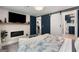 Spacious main bedroom featuring a fireplace, barn door to bathroom and connecting kitchen at 1981 Shalimar Ne Dr, Atlanta, GA 30345