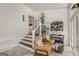 Sunroom showcasing white plank walls, staircase, seating, and bar area at 1981 Shalimar Ne Dr, Atlanta, GA 30345