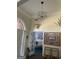 Open foyer with views to the living room and stylish light fixture at 3955 Sweetwater Pkwy, Ellenwood, GA 30294