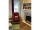 Cozy living room with fireplace and reading nook with natural light at 3955 Sweetwater Pkwy, Ellenwood, GA 30294