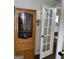 Comfortable sitting room with furniture and stylish french door detail at 3955 Sweetwater Pkwy, Ellenwood, GA 30294